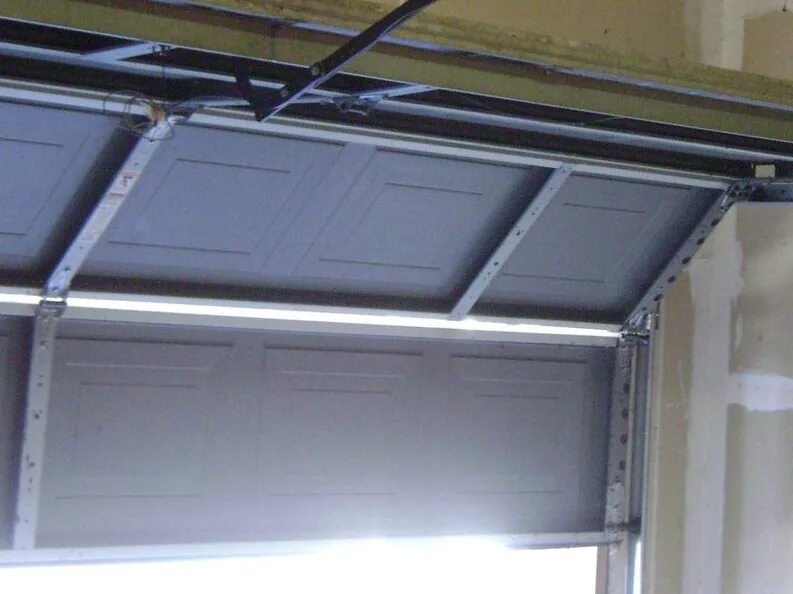the vertical track, rollers and struts inside a sectional door