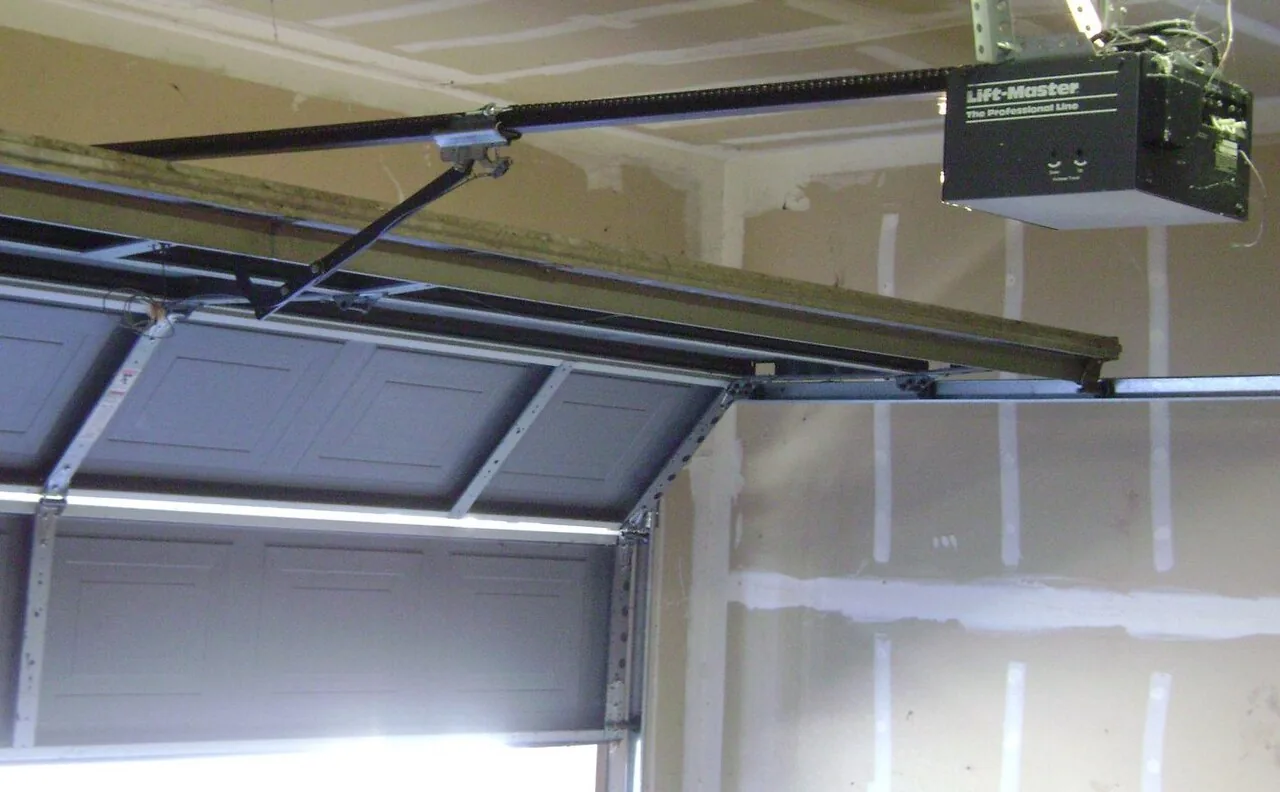 an opener rail connected to a raised sectional garage door